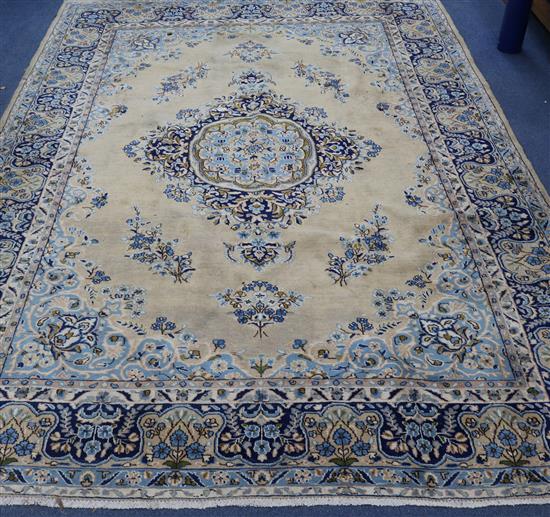 A Persian Kirman carpet 320 x 223cm